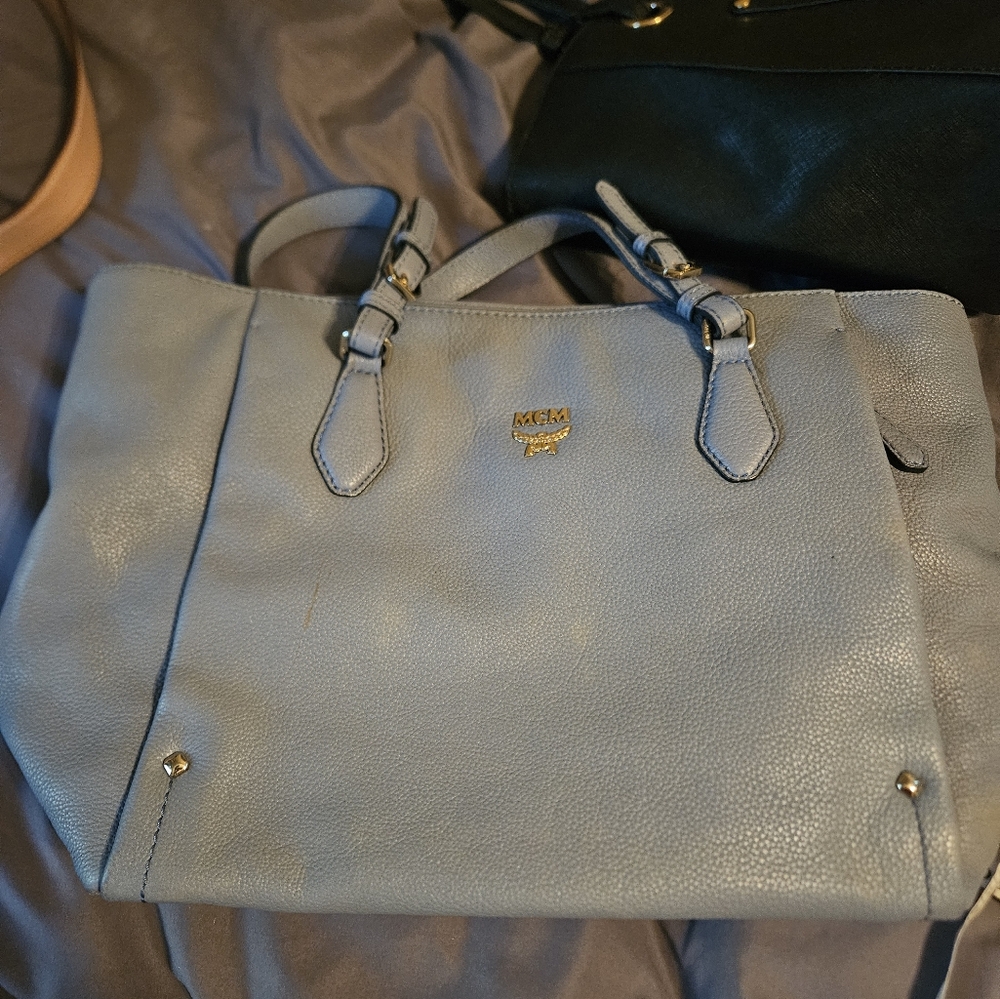 MCM Light Blue Leather Bag Does Have  Couple Of Whitish Spots And One Brown Mark